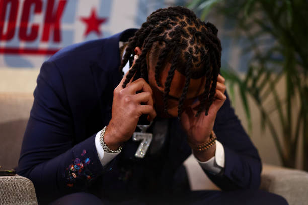 Stroud receives a phone call in the green room backstage before being drafted by the Houston Texans during the first round of the 2023 NFL Draft at...