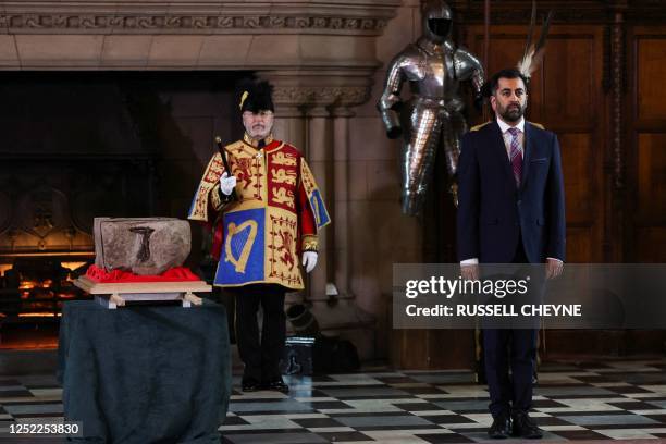 Scotland's First Minister Humza Yousaf stands by the Stone of Destiny during a special ceremony at Edinburgh Castle on April 27, 2023 before it is...
