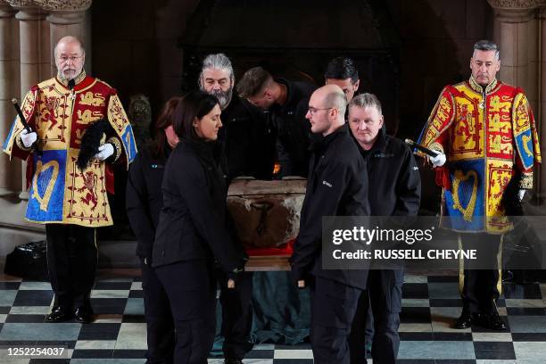 The Stone of Destiny is carried out of the Great Hall in Edinburgh Castle on April 27, 2023 during a special ceremony before it is transported to...