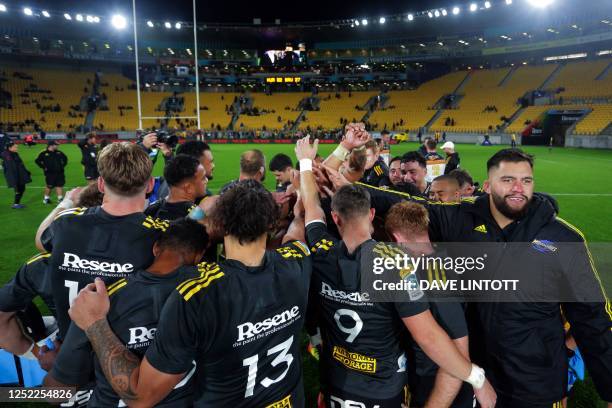 The Hurricanes players huddle after defeating ACT Brumbies during the Super Rugby Pacific match at Sky Stadium in Wellington on April 28, 2023.