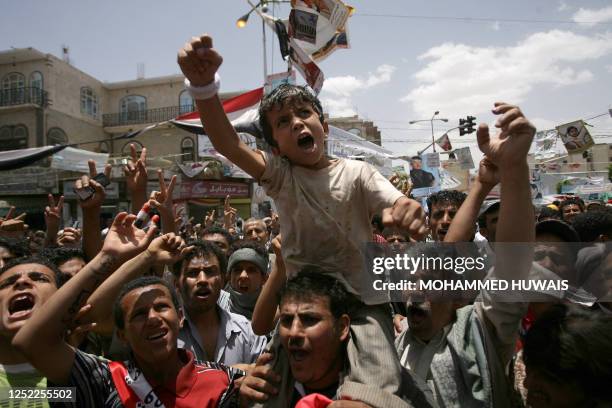 Anti-government protestors shout slogans during daily demonstrations demanding the resignation of Yemeni President Ali Abdullah Saleh, in the capital...