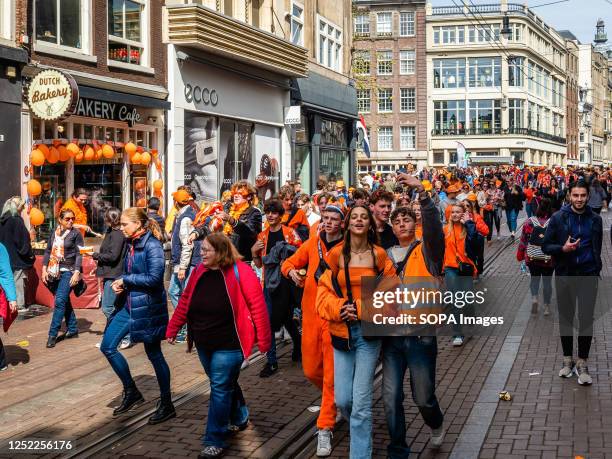 Dutch people and tourists are seen enjoying the day during the King's Day event. King's Day is renowned for being one of the biggest and most...