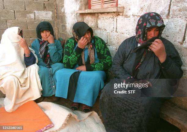 Women weep following the murder of 16 people by Islamic militants in Ain-Soltane, in the region of Khemis Miliana, 140 km west of the capital...