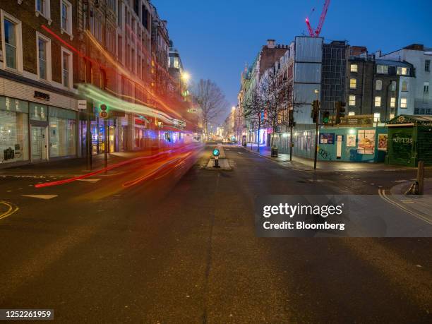 Light trails from passing vehicles outside a construction site on Oxford Street in London, UK, on Sunday, Jan. 22, 2023. Oxford Street is meant to be...