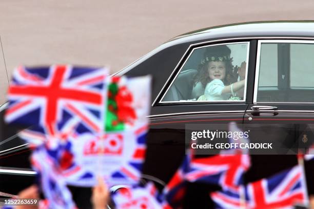 Young bridemaid Grace van Cutsem, three, the daughter of Prince William's friend Hugh van Cutsem, is driven past Buckingham Palace prior the royal of...