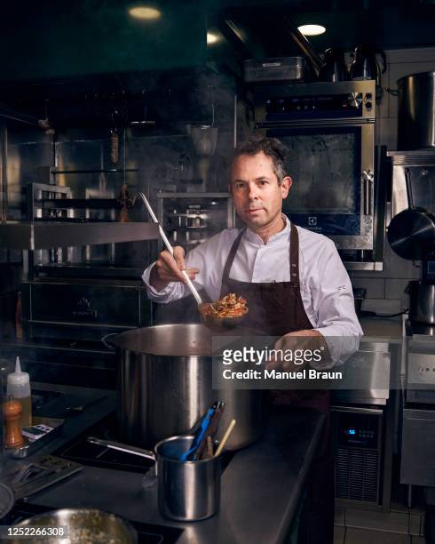 French Chef Pascal Barbot poses for a portrait in the kitchen of his restaurant L'Astrance, on January 23, 2023 in Paris, France.