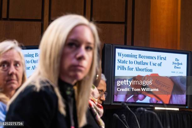 Amanda Zurawski of Austin, Texas, center, watches a video during the Senate Judiciary Committee hearing titled "The Assault on Reproductive Rights in...