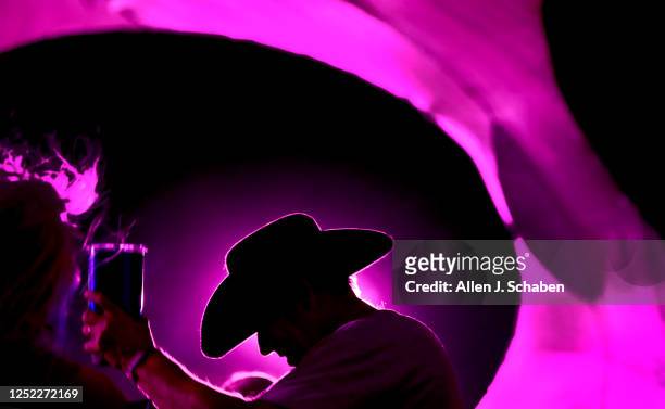 Country music fans dance at the K-Frog & KSON Dance Party in the Dome at the three-day Stagecoach Country Music Festival at the Empire Polo Club in...