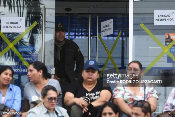 Workers and clients of the Fassil Bank protest outside the bank's headquarters to demand the resolution of their legal and working situation and to...