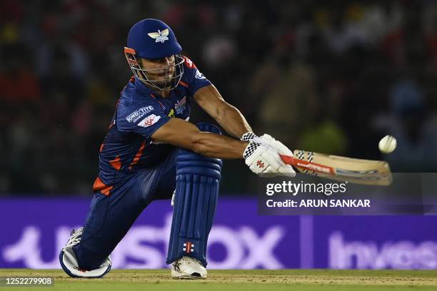 Lucknow Super Giants' Marcus Stoinis plays a shot during the Indian Premier League Twenty20 cricket match between Punjab Kings and Lucknow Super...