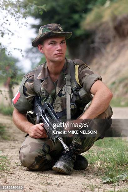 French Army paratrooper rests during a Cobra 1 patrol of the elite 3rd Company of the 3rd Paratrooper Regiment in the mountains of northern Kosovo...