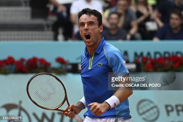 Spain's Roberto Bautista Agut reacts during his 2023 ATP Tour Madrid Open tennis tournament singles match against France's Quentin Halys at the Caja...