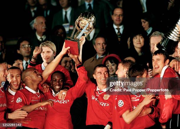 Manchester United players celebrate with the trophy during the presentation after winning the Intercontinental Cup between Manchester United and...