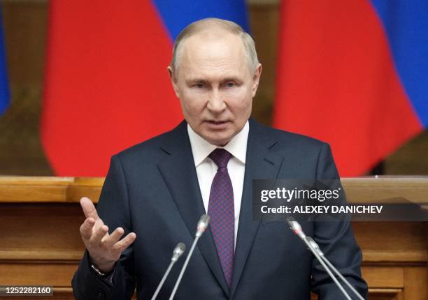 Russian President Vladimir Putin meets with members of the Legislative Council of the Federal Assembly ahead of Russia's Parliamentary Day in Saint...