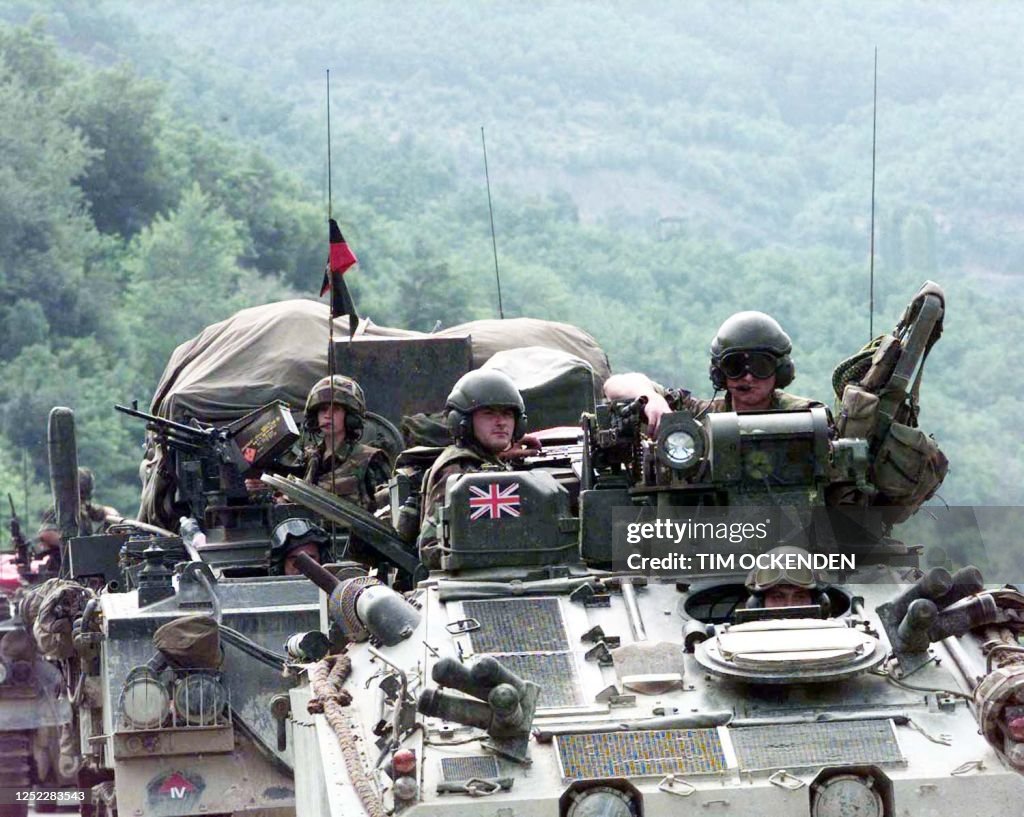 The British Fourth Armour Brigade await entry to the Kosovo borders