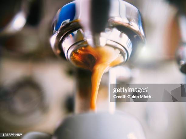 coffee machine pouring out espresso shot. - coffee machine stockfoto's en -beelden