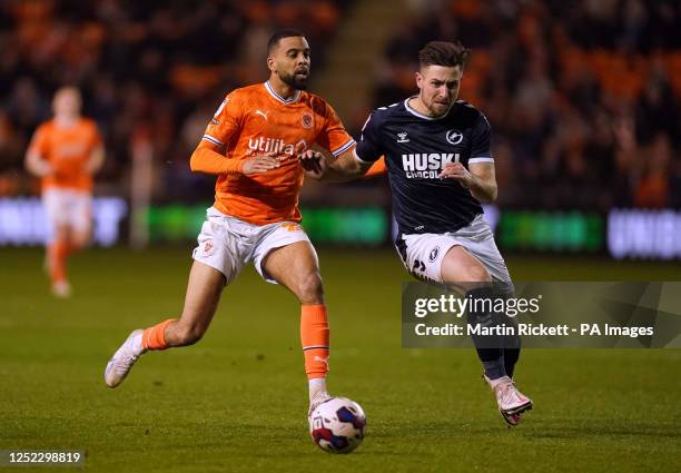 Blackpool's CJ Hamilton and Millwall's Ryan Leonard battle for the ball during the Sky Bet Championship match at Bloomfield Road, Blackpool. Picture...