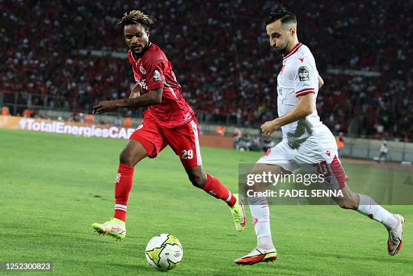 Enock Inonga Simba's Congolese defender Henock Inonga Baka marks Wydad's Moroccan ...