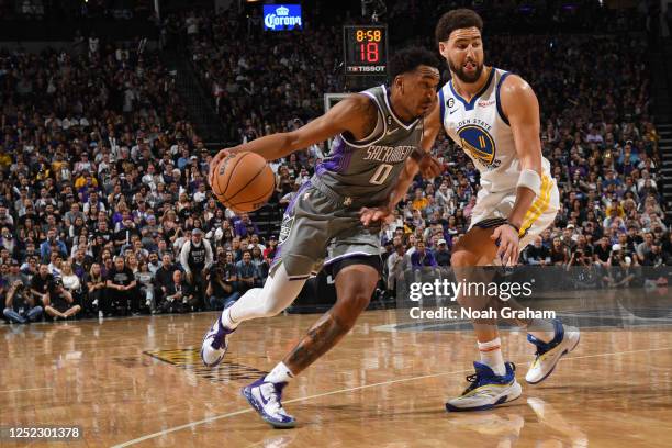 Malik Monk of the Sacramento Kings drives to the basket against the Golden State Warriors during Round 1 Game 5 of the 2023 NBA Playoffs on April 26,...