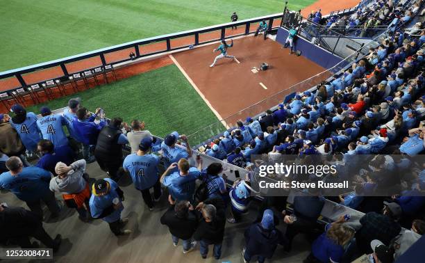 Seattle Mariners starting pitcher Luis Castillo warms up. The renovated outfield seats for fans allows them to be really close to the visiting club's...