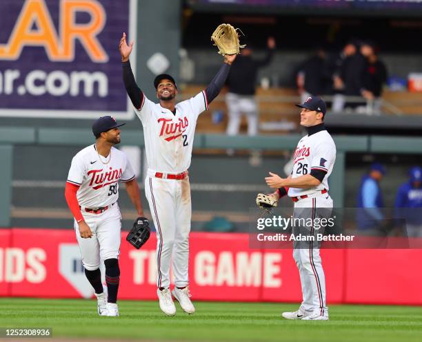 Willi Castro, Michael A. Taylor and Max Kepler of the Minnesota Twins celebrate their 8-6 win against the Kansas City Royals at Target Field on April...