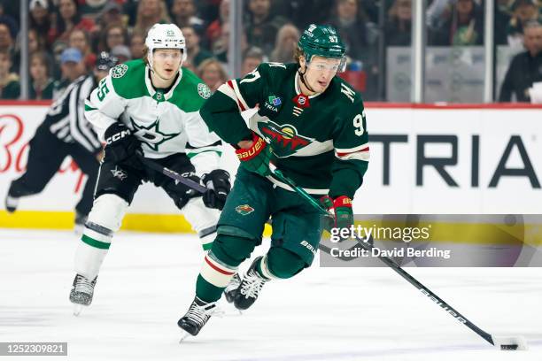 Kirill Kaprizov of the Minnesota Wild skates with the puck past Joel Kiviranta of the Dallas Stars in the first period in Game Six of the First Round...