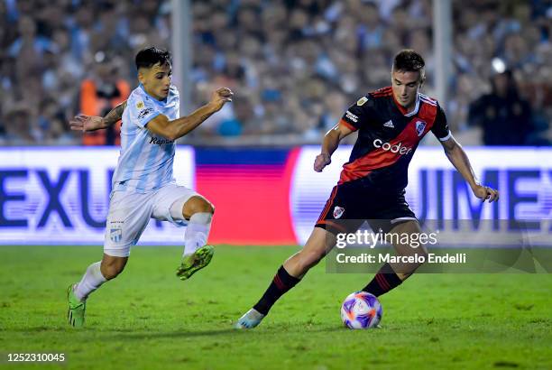 Agustin Palavecino of River Plate drives the ball during a Liga Profesional 2023 match between Atletico Tucuman and River Plate at Estadio Monumental...