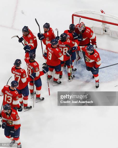 Teammates congratulate Goaltender Sergei Bobrovsky of the Florida Panthers after the 7-5 win against the Boston Bruins in Game Six of the First Round...