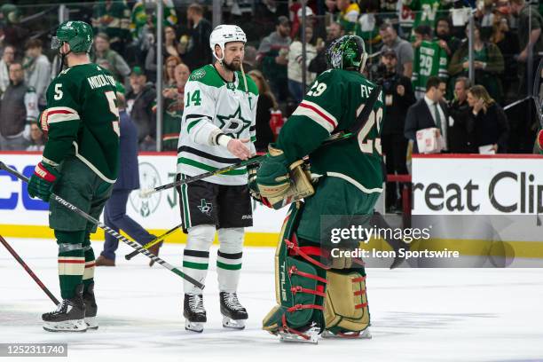 Dallas Stars left wing Jamie Benn shakes hands with Minnesota Wild center Gustav Nyquist after Game Six of the First Round of the 2023 Stanley Cup...