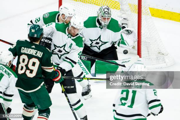 Jake Oettinger of the Dallas Stars makes a save against the Minnesota Wild in the third period in Game Six of the First Round of the 2023 Stanley Cup...