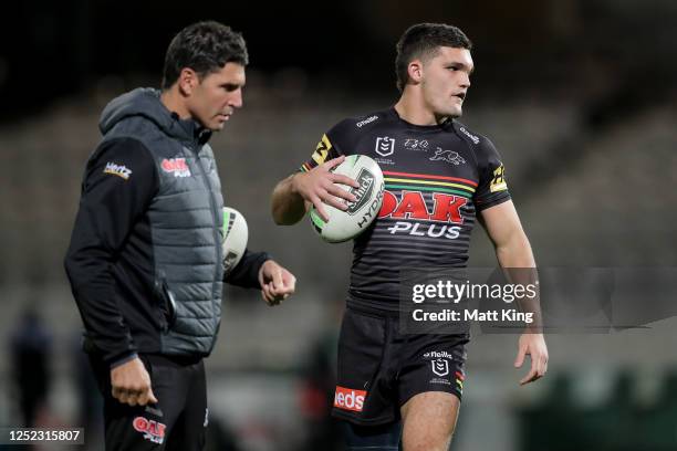 Nathan Cleary of the Panthers and assistant coach Trent Barrett are seen before the round seven NRL match between the Penrith Panthers and the South...