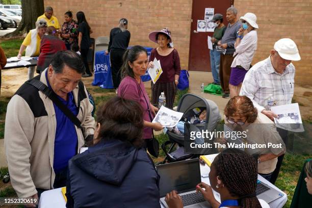 In an event hosted by Second Story, families gather for resources, including Medicaid eligibility and enrollment information offered by Neighborhood...