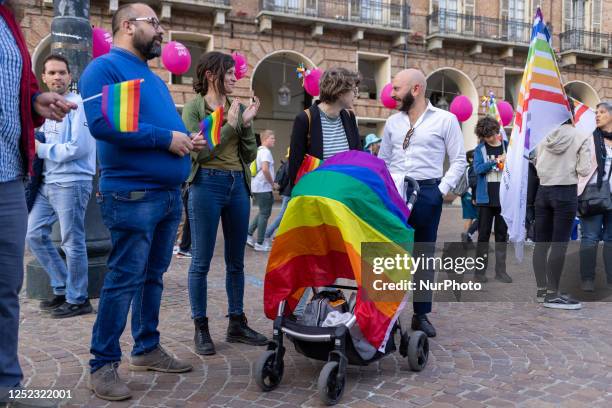 The rainbow families, an association of families with homosexual parents demonstrate in the square Piazza Castello, Torino Italy, on april 28 wearing...