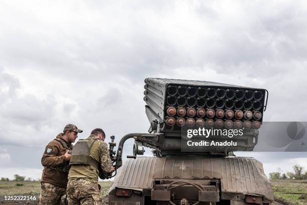 Ukrainian soldiers enter coordinates to fire grad missiles from a BM-21 at their position in the direction of Bakhmut as the Russia-Ukraine war...