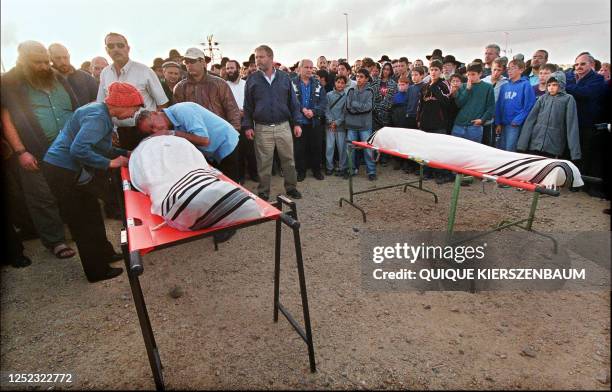 Th grandparents mourn over the body of Yosef Ishran 14, as the bodies of him and his friend Yaaakov Nathan lie in state at the Gush Etzion junction...