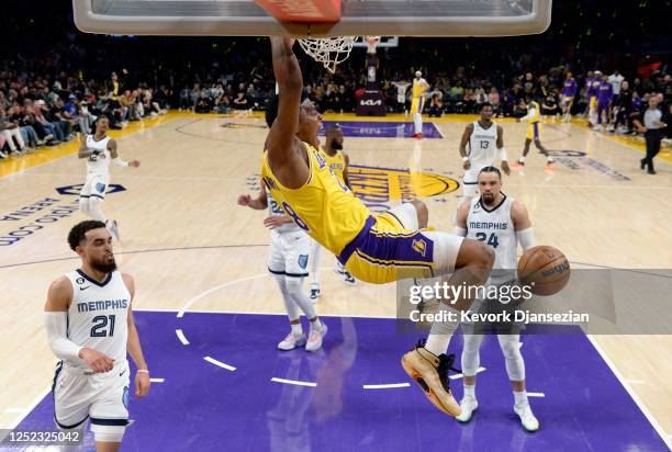 Rui Hachimura of the Los Angeles Lakers a slam dunks against the Dillon Brooks of the Memphis Grizzlies during the first half of Round 1 Game 6 of...