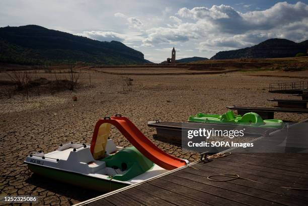 Pedal boats on dry soil clods are seen at the Sau water reservoir. The water resevoir, one of the main sources of water of the spanish region of...