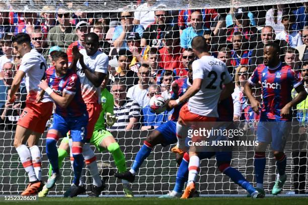 West Ham United's Czech midfielder Tomas Soucek shoots to score the opening goal of the English Premier League football match between Crystal Palace...