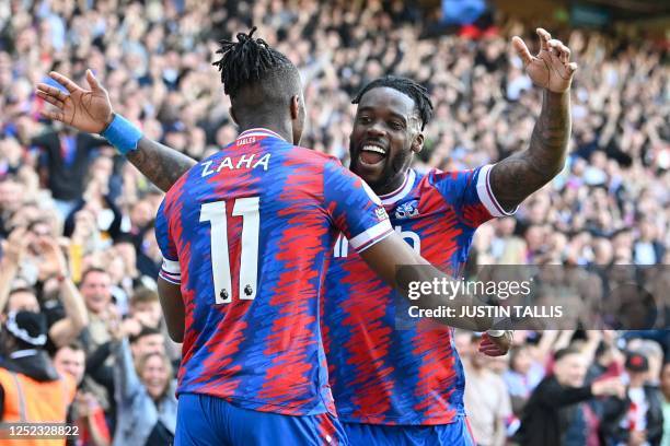 Crystal Palace's Ivorian striker Wilfried Zaha celebrates with Crystal Palace's German midfielder Jeffrey Schlupp after scoring their second goal...