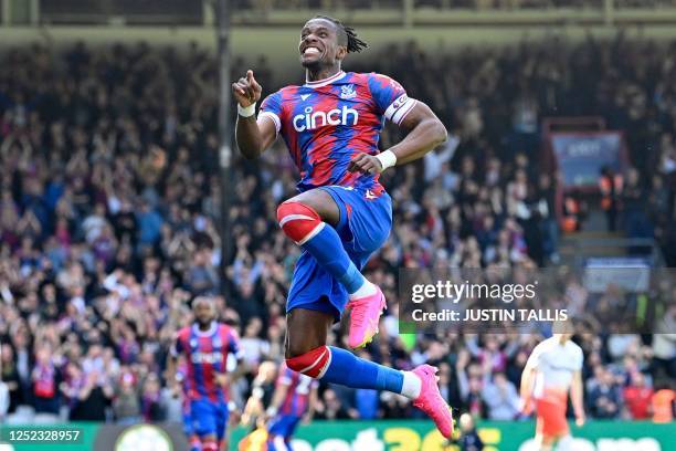 Crystal Palace's Ivorian striker Wilfried Zaha celebrates after scoring their second goal during the English Premier League football match between...