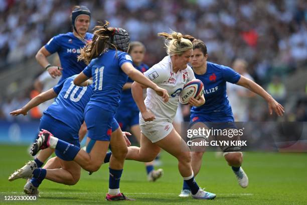 England's flanker Marlie Packer runs with the ball to score a try during the Six Nations international women's rugby union match between England and...