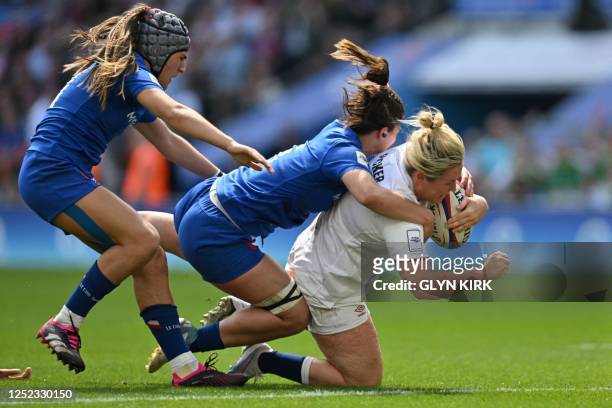 England's flanker Marlie Packer scores a try during the Six Nations international women's rugby union match between England and France at Twickenham...