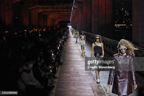 Models walk on the runway during the Louis Vuitton Pre-Fall 2023 Women's Collection show on the Jamsu bridge in Seoul, South Korea, on Saturday,...