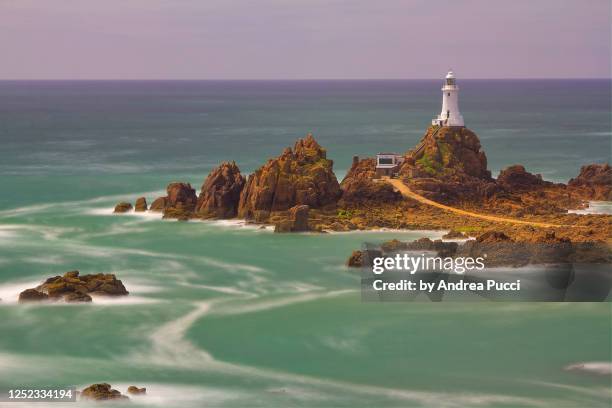 la corbiere lighthouse, jersey, united kingdom - jersey channel islands stock pictures, royalty-free photos & images