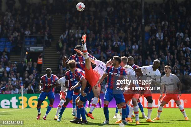 West Ham United's Moroccan defender Nayef Aguerd fails to connect with the ball during the English Premier League football match between Crystal...