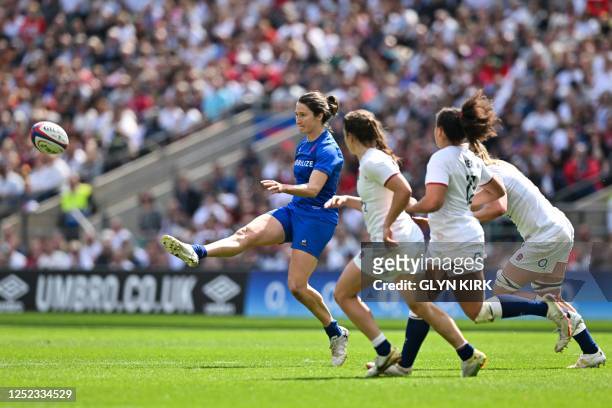 France's fly-half Jessy Tremouliere kicks the ball during the Six Nations international women's rugby union match between England and France at...
