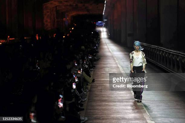 Sora Choi, a fashion model, walks on the runway during the Louis Vuitton Pre-Fall 2023 Women's Collection show on the Jamsu bridge in Seoul, South...