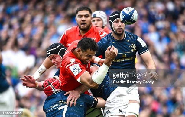 Dublin , Ireland - 29 April 2023; Richie Arnold of Toulouse knocks in the tackle by Josh van der Flier and James Ryan of Leinster during the Heineken...