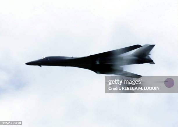 Lancer performs a low-level fly-by for troops deployed for Operation Enduring Freedom on 27 October 2001. The B-1B's three internal weapons bays can...