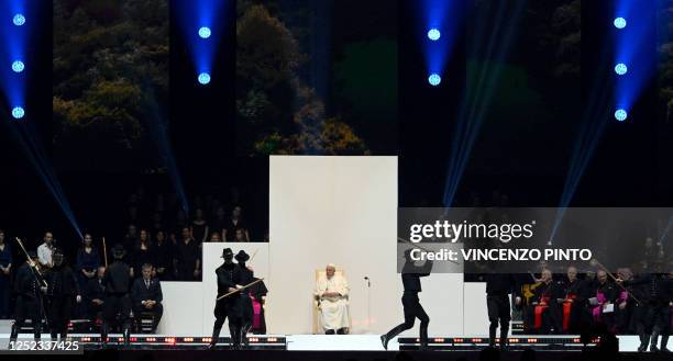 Pope Francis watches a dance performance as he meets with young people at Papp Laszlo Sportarena during his visit in Budapest, Hungary, April 29,...